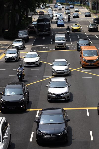 Vehicles on the road in the Central Business District (CBD) of Singapore, 05 October 2023. The cost of a certificate to own a car in Singapore, known as the Certificate of Entitlement (COE), has rose to a record high of S$146,002 (101,282 euros) in the open bidding exercise on 04 October, according to the Land Transport Authority (LTA). The COE system was introduced in 1990 to counter congestion on the roads where potential car owners must bid for a certificate for the right to own a vehicle for a period of ten years. EPA / HOW HWEE YOUNG