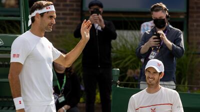 Roger Federer and Andy Murray at a practice session at The All England Club. PA