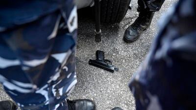 An armed woman and a dozen activists reportedly broke into a Beirut bank branch to retrieve more than $13,000 from what she said were her trapped savings. Lebanon's cash-strapped banks since 2019 have imposed strict limits on withdrawals of foreign currency, tying up the savings of millions. AP Photo