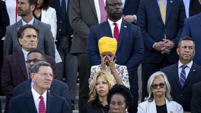 Congresswoman Ilhan Omar tears up as members of Congress hold a moment of silence for the 600,000 American lives lost to COVID-19, on the steps of the U. S. Capitol on June 14, 2021. The rate of severe illness and death continues to drop as more Americans get vaccinated. AFP