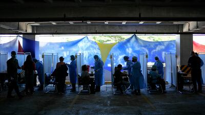 Healthcare workers prepare doses of the Sputnik V vaccine for COVID-19 as seniors and those considered high risk for contagion are eligible at a vaccination center set up in the parking lot of the Armed Forces Social Prevision Institute (IPSFA) in Caracas, Venezuela, Monday, June 7, 2021. AP Photo