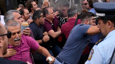 Police clash with protesters outside a courthouse in Kalamata, south-western Greece, where nine Egyptian men face trial, accused of causing a shipwreck that killed hundreds of migrants. AP