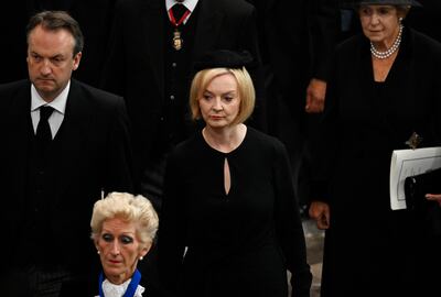 LONDON, ENGLAND - SEPTEMBER 19: Prime Minister of The United Kingdom, Liz Truss departs Westminster Abbey after the funeral service of Queen Elizabeth II on September 19, 2022 in London, England. Elizabeth Alexandra Mary Windsor was born in Bruton Street, Mayfair, London on 21 April 1926. She married Prince Philip in 1947 and ascended the throne of the United Kingdom and Commonwealth on 6 February 1952 after the death of her Father, King George VI. Queen Elizabeth II died at Balmoral Castle in Scotland on September 8, 2022, and is succeeded by her eldest son, King Charles III. (Photo by Gareth Cattermole / Getty Images)