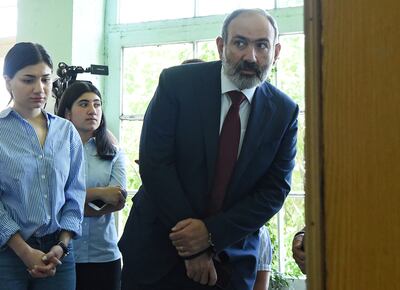 Armenia's acting prime minister visits a polling station to cast his vote during the snap parliamentary election in Yerevan, Armenia. Reuters