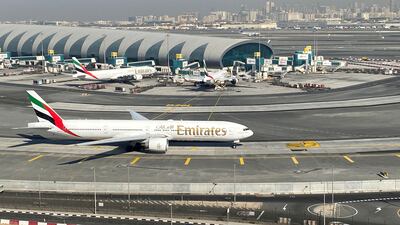 FILE PHOTO: Emirates airliners are seen on the tarmac in a general view of Dubai International Airport in Dubai, United Arab Emirates January 13, 2021. Picture taken through a window. REUTERS / Abdel Hadi Ramahi / File Photo