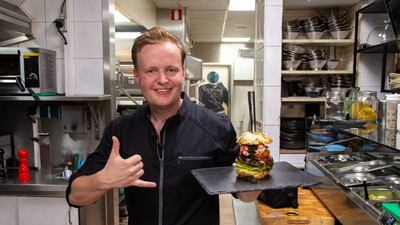 Dutch restaurant owner Robbert Jan de Veen with The Golden Boy burger. Courtesy De Daltons