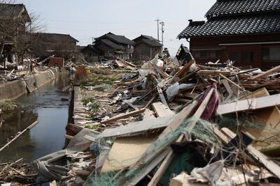 This photo shows a general view of the debris and damage in Noto Town, Ishikawa prefecture on March 31, 2024 three months after the New Year's earthquake and tsunami. (Photo by JIJI Press / AFP) / Japan OUT