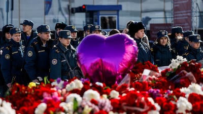 Cadets of the Fire and Rescue College stand in front of at a makeshift memorial near the Crocus City Hall following a deadly attack on the concert venue in the Moscow Region, Russia, on March 27. Reuters