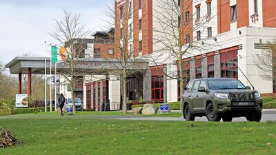 Irish Army personnel leave the Crowne Plaza hotel after assisting in the transfer of airline passengers. Getty Images