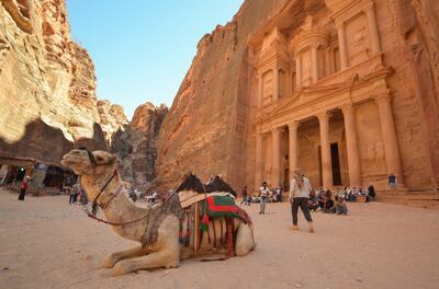 Tourists gather in front of the treasury site in the ancient city of Petra, Jordan on July 2, 2021. Reuters