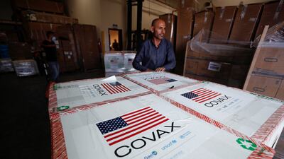 Palestinians receive a shipment of doses with the Moderna coronavirus disease (COVID-19) vaccine donated by the U. S, in Salem village, in the Israeli-occupied West Bank, August 24, 2021. REUTERS / Mohamad Torokman
