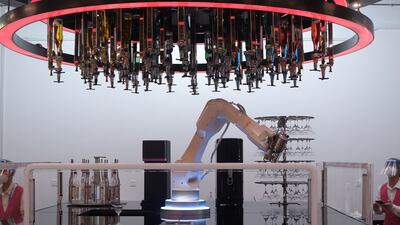 A robotic arm prepares drinks at the bar area of the Main Media Centre on day 13 of 2022 Beijing Winter Olympics on February 17, 2022. Getty Images