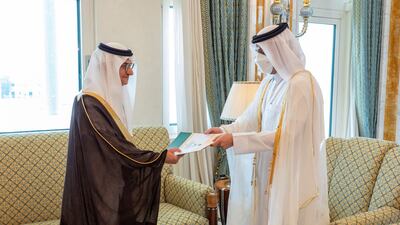 Qatari Deputy Prime Minister and Minister of Foreign Affairs Sheikh Mohammed Bin Abdulrahman Al Thani(R) receiving a copy of the credentials of the Ambassador of the Kingdom of Saudi Arabia Prince Mansour bin Khalid bin Farhan Al Saud, in Doha on June 21, 2021. AFP