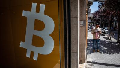 A Bitcoin logo inside a BitBase cryptocurrency exchange in Barcelona, Spain, on Monday, May 16, 2022.