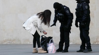 Police officers checked people heading to the concert hall. EPA