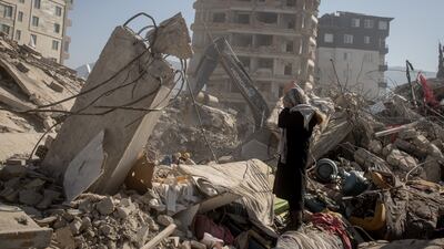 HATAY, TURKEY - FEBRUARY 15: A relative mourns amid rubble as rescue workers recover the body of a loved one on February 15, 2023 in Hatay, Turkey. A 7.8-magnitude earthquake hit near Gaziantep, Turkey, in the early hours of February 6, followed by another 7.5-magnitude tremor just after midday. The quakes caused widespread destruction in southern Turkey and northern Syria and has killed more than 30,000 people. (Photo by Chris McGrath / Getty Images)