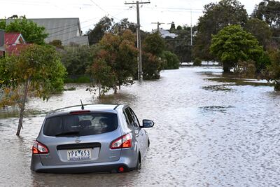 A submerged car is seen in flood waters in Maribyrnong, Melbourne, Australia, 14 October 2022. Victorian residents have been told to move to higher ground as rain continue to pummel vast swathes of the state, causing flooding and thousands of power outages. EPA / JAMES ROSS AUSTRALIA AND NEW ZEALAND OUT