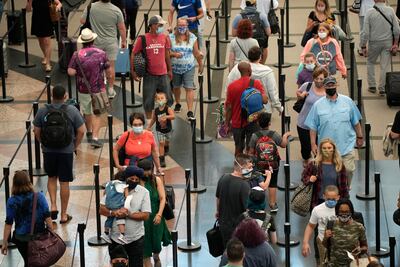 Travellers pass through a security checkpoint at Denver International Airport. The US has now been added to the EU's White List of countries. (AP Photo / David Zalubowski)