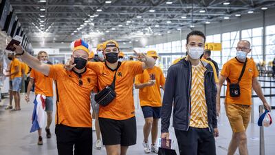 Football fans arrive at Amsterdam Airport Schiphol for their flight to Budapest, near Amsterdam, The Netherlands, 27 June 2021. The Dutch team plays against the Czech Republic in their UEFA EURO 2020 round of 16 soccer match in the Hungarian capital. EPA / RAMON VAN FLYMEN