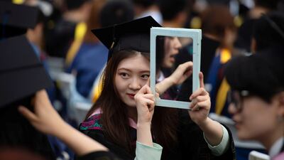 Graduates, including students who could not attend last year due to the coronavirus disease (COVID-19) pandemic, attend a graduation ceremony at Central China Normal University in Wuhan, Hubei province, in China on June 13. Picture taken June 13. Reuters