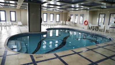 The swimming pool in the building.
