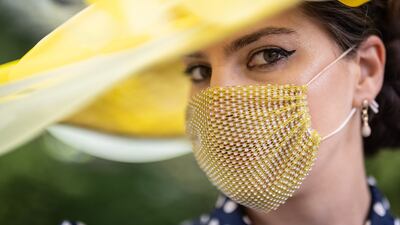 A racegoer shows off a fashionable face mask at Royal Ascot. Getty Images