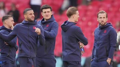 (From L) England's defender Kyle Walker, England's defender Harry Maguire, England's forward Harry Kane and England's players inspect the pitch before the start of the UEFA EURO 2020 semi-final football match between England and Denmark at Wembley Stadium in London on July 7, 2021. (Photo by Frank Augstein / POOL / AFP)