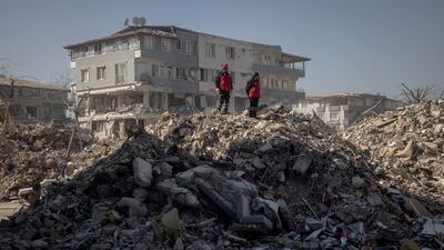 Rescue workers oversee an operation from the top of a pile of rubble on February 15, 2023 in Hatay, Turkey. Getty Images