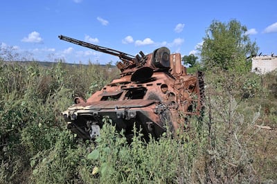 A photo shows a Ukrainian armored personnel carrier destroyed during the fighting in the village of Kamianka near the town of Izium, Kharkiv region, on September 5, 2023, amid the Russian invasion of Ukraine. The village was occupied by the Russian troops for over five months from April to September 2022. (Photo by SERGEY BOBOK / AFP)