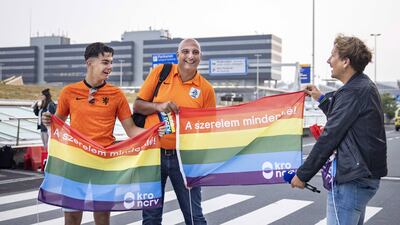 Dutch presenter Klaas van Kruistum hands football fans rainbow flags during recordings for the TV program 'Klaas anything is possible,' at Amsterdam Airport Schiphol, near Amsterdam, The Netherlands, 27 June 2021. Van Kruistum hopes to convince fans to speak out in Hungary against the anti-gay law. The Dutch team plays against the Czech Republic in their UEFA EURO 2020 round of 16 soccer match in the Hungarian capital. EPA / RAMON VAN FLYMEN