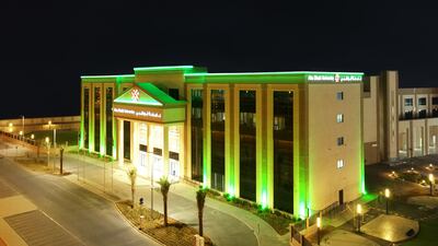 Abu Dhabi University in Al Ain lighting up green.