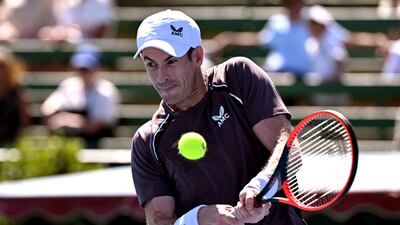 Britain's Andy Murray hits a return during his men's singles match against Dominic Thiem of Austria at the Kooyong Classic tennis tournament in Melbourne on January 11, 2024. (Photo by William WEST / AFP) / --IMAGE RESTRICTED TO EDITORIAL USE - STRICTLY NO COMMERCIAL USE--