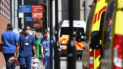 National Health Service staff outside the Royal London Hospital. British Prime Minister Boris Johnson has announced a delay to lockdown easing. The UK government will delay England's full reopening for a further four weeks owing to a significant rise in Delta variant Covid-19 cases. EPA