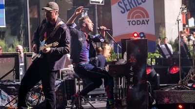 Jonny Buckland, left, and Chris Martin from the band Coldplay perform on NBC's "Today" show at Rockefeller Plaza on Thursday, June 17, 2021, in New York. (Photo by Charles Sykes / Invision / AP)