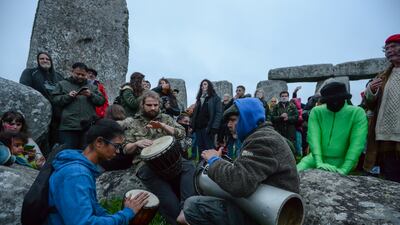 People play drums to celebrate the Summer Solstice at Stonehenge. Getty Images