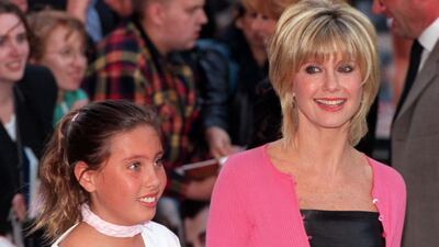 File photo dated 25/06/98 of Olivia Newton-John arrives with her daughter Chloe, for the premiere of the 20th anniversary re-issue of the musical Grease, at the Empire, Leicester Square, London. Dame Olivia Newton-John has died at the age of 73, her widower has confirmed. The British-born singer died "peacefully" at her ranch in Southern California on Monday morning, surrounded by family and friends. Issue date: Tuesday August 9, 2022.