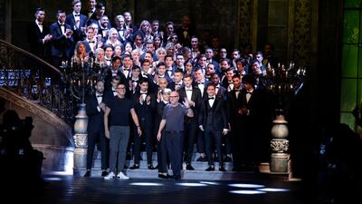 FILE - In this Saturday, Jan. 14, 2017 filer, fashion designers Domenico Dolce and Stefano Gabbana acknowledge the applause at the end of the Dolce & Gabbana men's Fall-Winter 2017-2018 collection, part of the Milan Fashion Week, unveiled in Milan, Italy, (AP Photo / Luca Bruno, File)