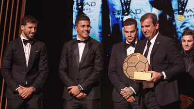 TOPSHOT - Manchester City Spanish CEO Ferran Soriano (2ndR) walks on stage with the trophy as Manchester City receives the Men's Best Club of the Year trophy, next to Manchester City's Portuguese defender Ruben Dias (L), Manchester City's Spanish midfielder Rodri, Manchester City's Brazilian goalkeeper Ederson Santana de Moraes and Ivorian former football player and Manchester City's Argentinian forward Julian Alvarez during the 2023 Ballon d'Or France Football award ceremony at the Theatre du Chatelet in Paris on October 30, 2023. (Photo by FRANCK FIFE / AFP)