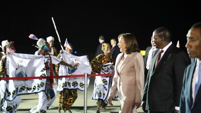 U. S. Vice President Kamala Harris, third right, with her husband Douglas Emhoff, not in photo, is welcomed by Tanzania's Vice President Philip Mpango, second right, on their arrival at Julius Nyerere International Airport in Dar es Salaam Wednesday, March 29, 2023. (Ericky Boniphace / Pool Photo via AP)