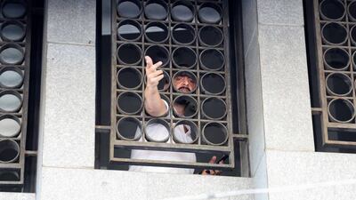 A man identified as Abed Soubra inside a Blom Bank branch, in the Tariq Al Jdideh neighbourhood of Beirut. Reuters