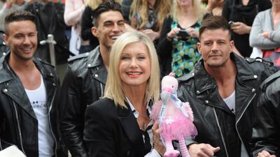 A handout photo made available by the Las Vegas News Bureau shows Olivia Newton-John arriving at the Flamingo in Las Vegas, Nevada, USA, 02 April 2014 (issued 09 August 2022). Olivia Newton-John died from cancer at the age of 73 at her home in Southern California on 08 August 2022. EPA / BRIAN JONES / LAS VEGAS NEWS BUREAU / HANDOUT Mandatory credit: EPA via Las Vegas News Bureau / Brian Jones HANDOUT EDITORIAL USE ONLY / NO SALES