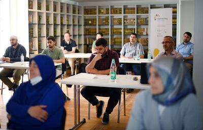 Students take part in a Quran recitation lesson at the college, which opened this week. AFP