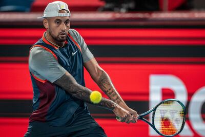 Nick Kyrgios of Australia hits a return against Tseng Chun-hsin of Taiwan during their men's singles match at the Japan Open tennis tournament in Tokyo on October 4, 2022. (Photo by Yuichi YAMAZAKI / AFP)